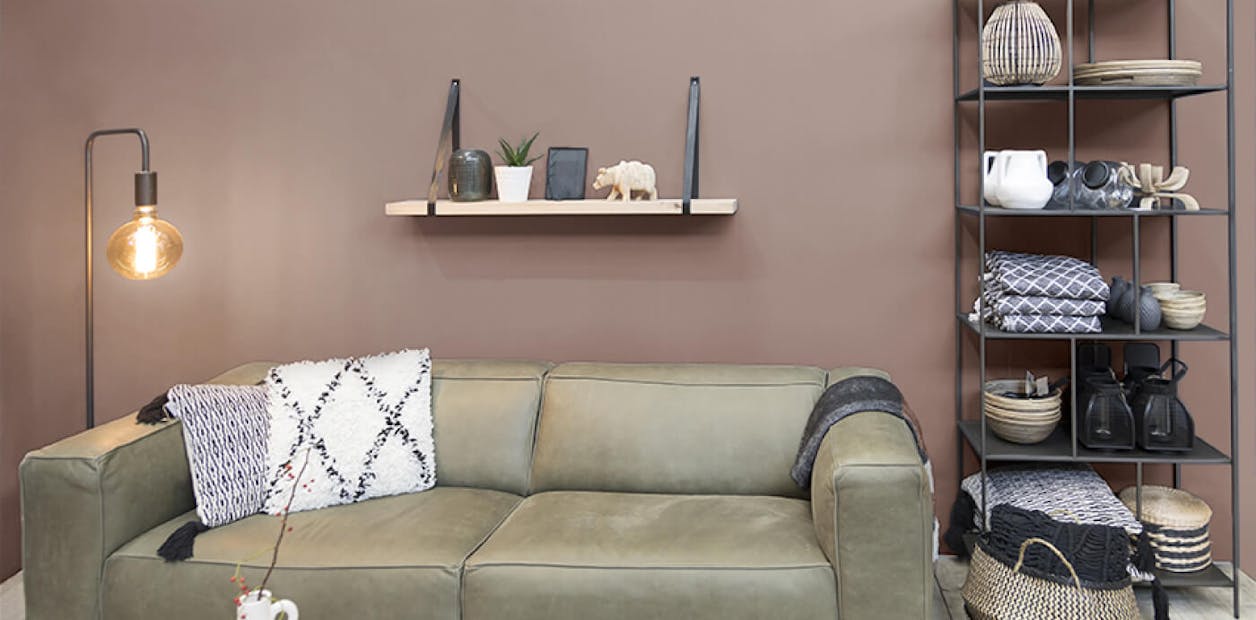 Brown walls give a reception room a rich and earthy quality.