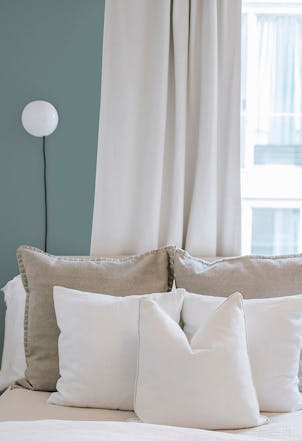 Bedroom painted with a soft grey 