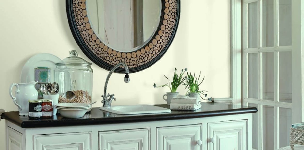 White bathroom wall with a green undertone