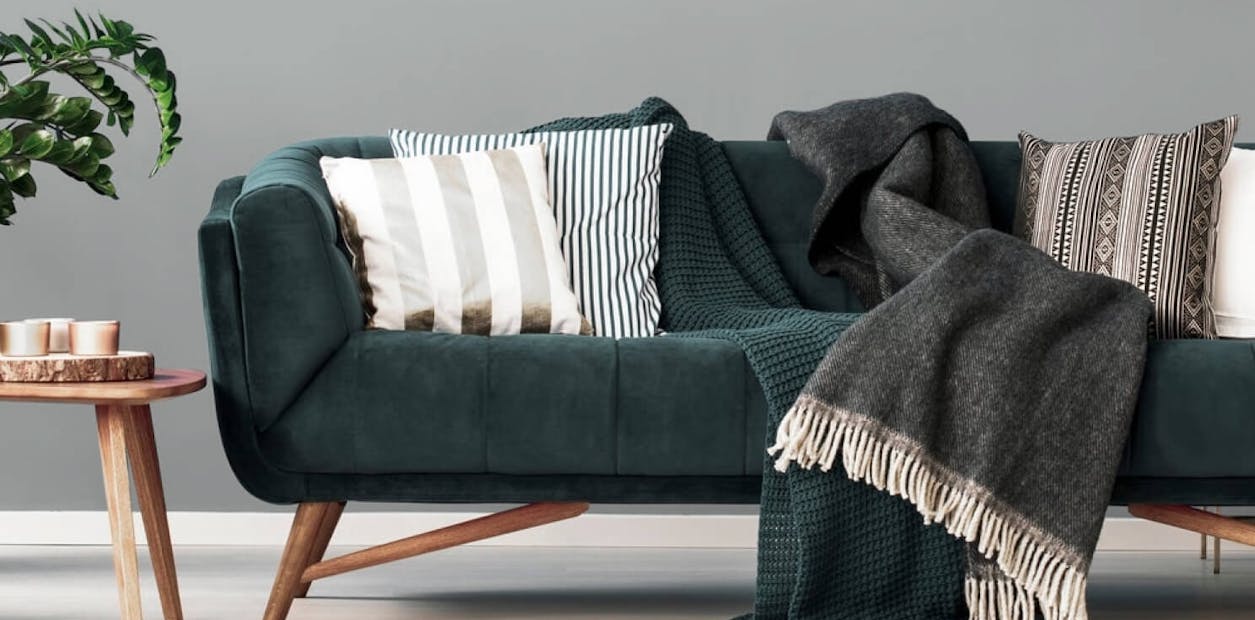 Warm greys have a middling tonality that works well with greens and can change a reception room completely.