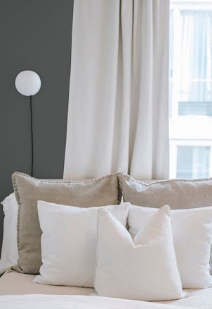 Bedroom painted with a darker grey shade